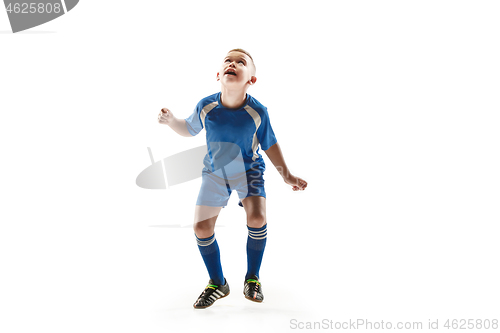 Image of Young boy with soccer ball doing flying kick