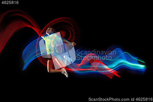 Image of one caucasian young teenager girl woman playing Badminton player on black background