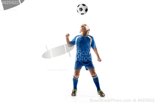 Image of Young boy with soccer ball doing flying kick