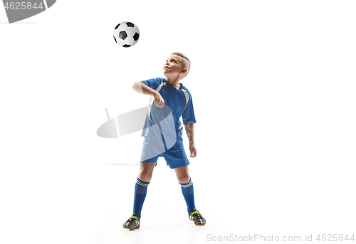 Image of Young boy with soccer ball doing flying kick