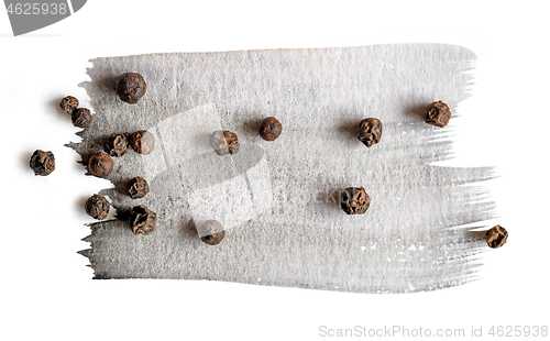 Image of black pepper on watercolor paint