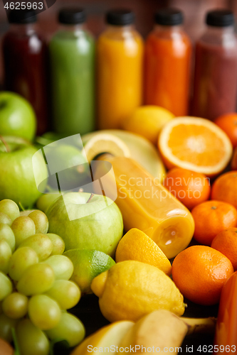 Image of Colorful bottles filled with fresh fruit and vegetable juice or smoothie