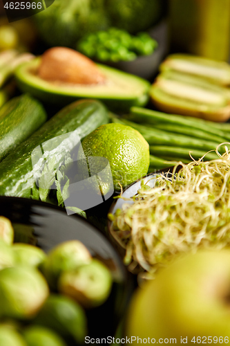 Image of Green healthy food composition with avocado, broccoli, apple, smoothie...