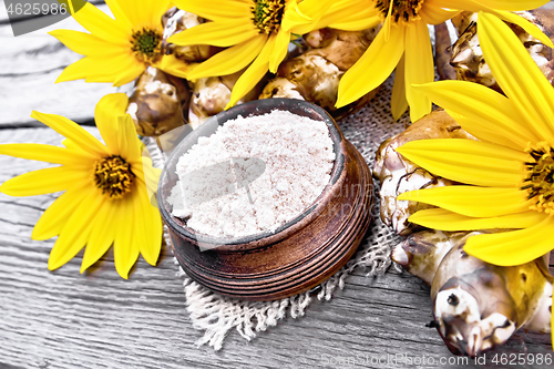 Image of Flour of Jerusalem artichoke in bowl on old board