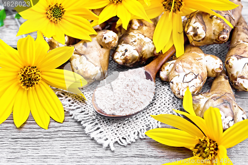 Image of Flour of Jerusalem artichoke in spoon on old board