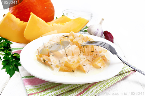 Image of Pumpkin with sour cream sauce in plate on light board