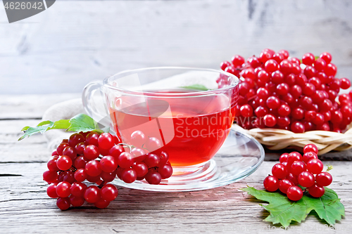 Image of Tea from viburnum in cup on board