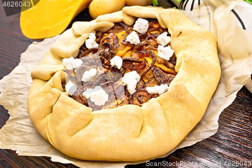 Image of Pie with pumpkin and onions on parchment