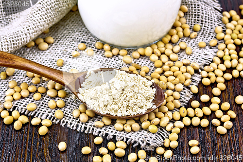 Image of Flour soy in spoon with soybeans on sacking