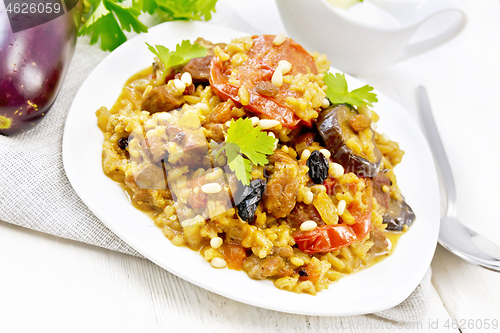 Image of Rice with vegetables and chicken in plate on board