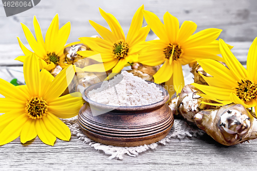 Image of Flour of Jerusalem artichoke in bowl on board