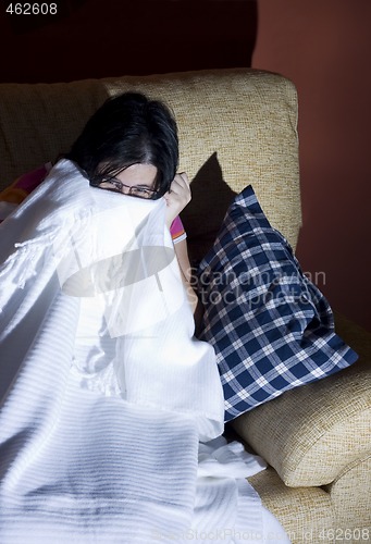 Image of woman watching an horror movie