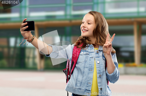 Image of teenage student girl taking selfie by smartphone