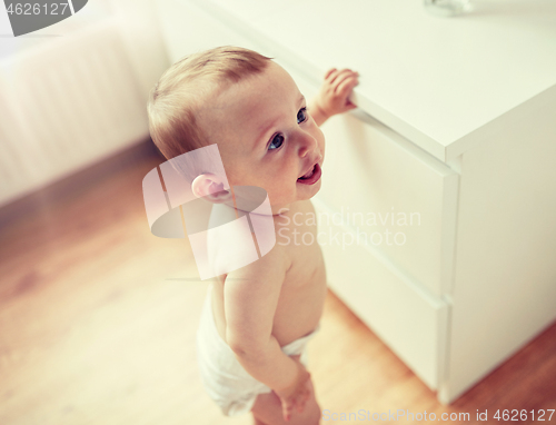 Image of close up of happy little baby boy or girl at home