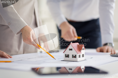 Image of close up of architects discussing house project