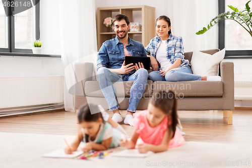 Image of happy family spending free time at home