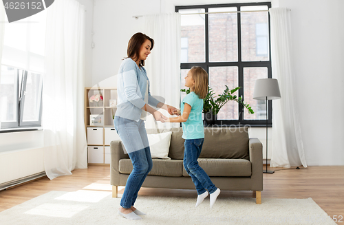 Image of mother and daughter having fun at home