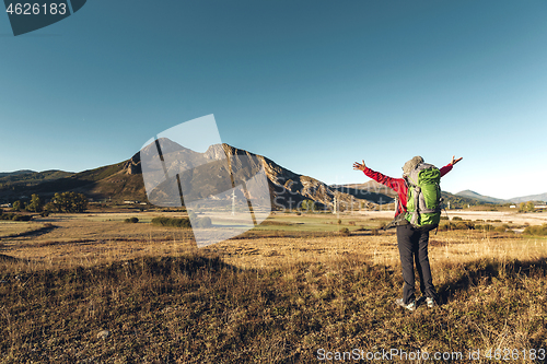 Image of Backpack woman enjoying the view