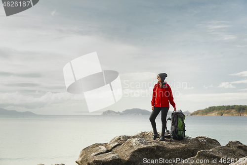 Image of Woman exploring the coast