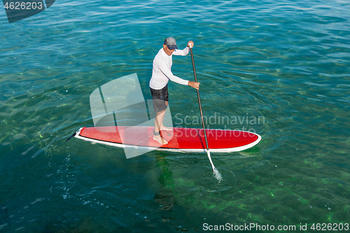 Image of Senior man practicing paddle