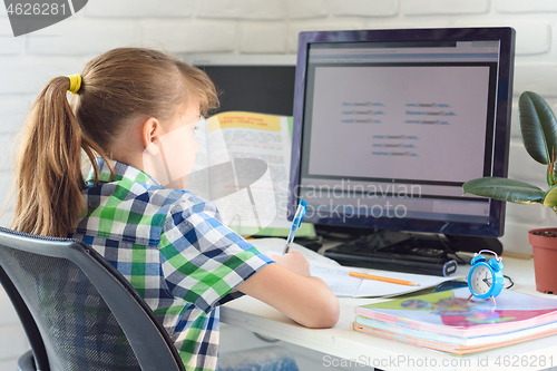 Image of distance learning at home in front of a computer