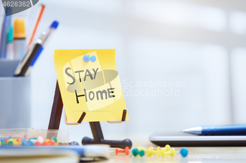 Image of Stay Home text on adhesive note at the office