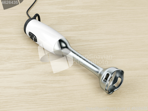 Image of Hand blender on wood background