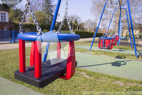 Image of Empty swings in children&#39;s playground during lockdown