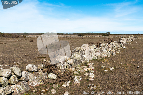 Image of Broken dry old traditional stonewall