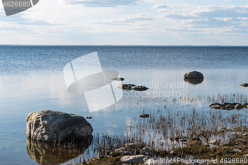 Image of Rocks by the coast in calm water