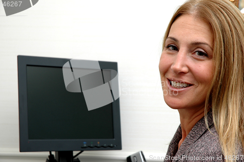 Image of cheerful business woman in office