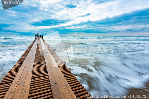 Image of Beautiful seascape after sunset, waves blurred by long exposure