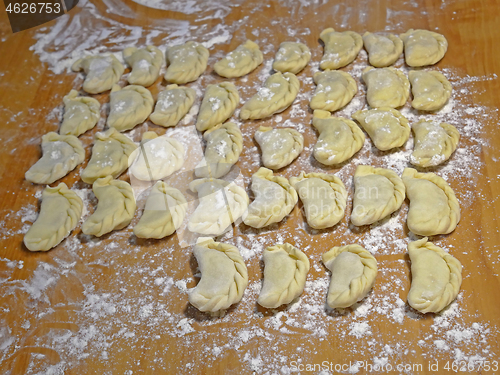 Image of Dumplings on the yellow kitchen board