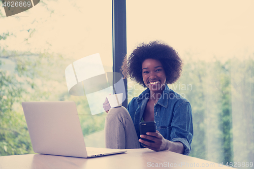 Image of African American woman in the living room