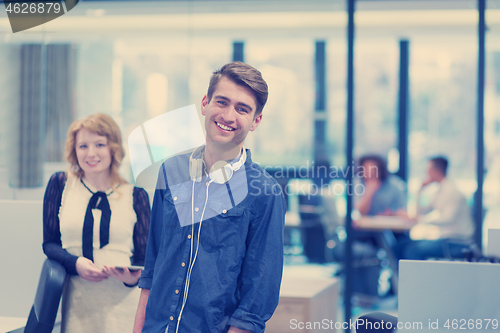 Image of Business People Working With Tablet in startup office