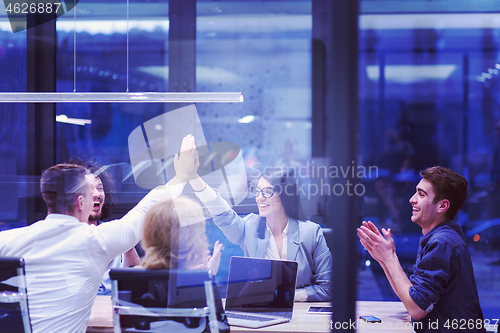 Image of startup Group of young business people celebrating success