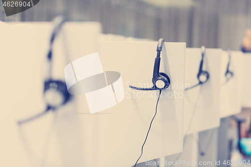 Image of Headphones in empty call center office