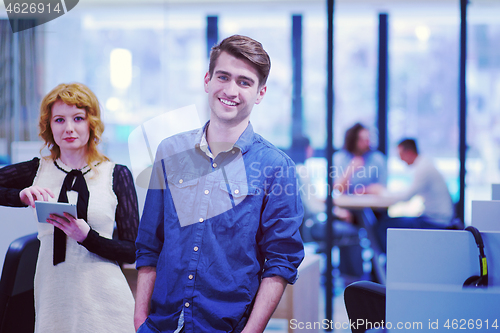 Image of Business People Working With Tablet in startup office