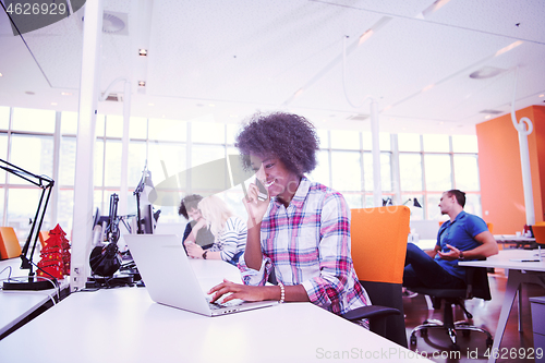 Image of African American informal business woman working in the office