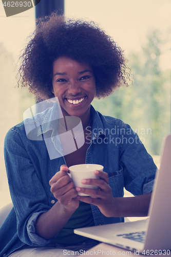 Image of African American woman in the living room