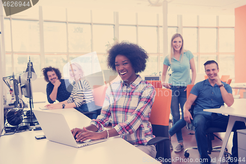 Image of African American informal business woman working in the office