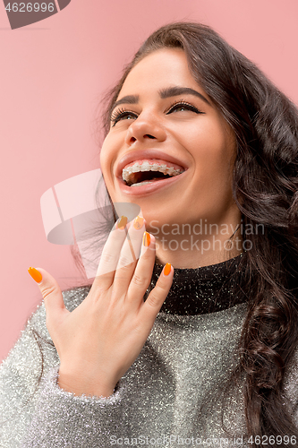 Image of Beautiful young woman with teeth braces