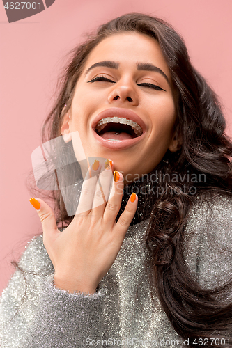 Image of Beautiful young woman with teeth braces