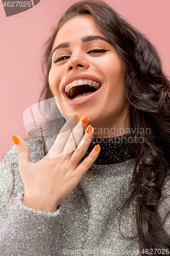 Image of Beautiful young woman with teeth braces