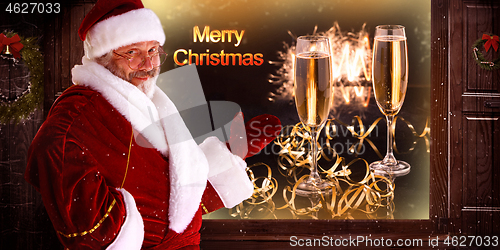 Image of The man in costume of santa claus over night city background