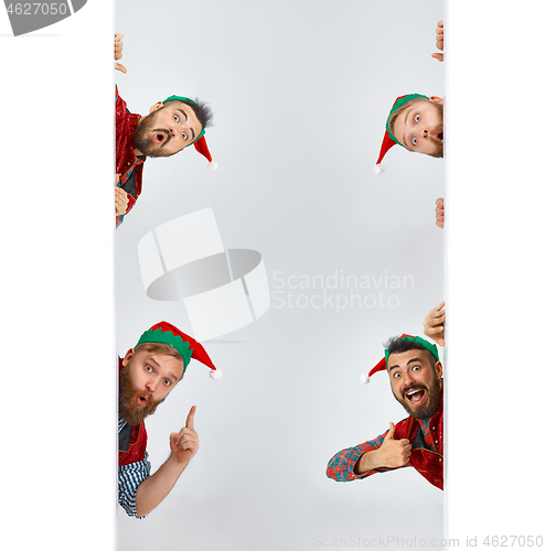 Image of friendly men dressed like a funny gnome posing on an isolated gray background