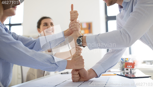 Image of group of business team making thumbs up gesture