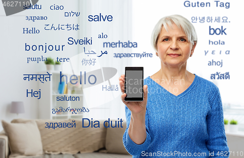 Image of senior woman using translator on smartphone