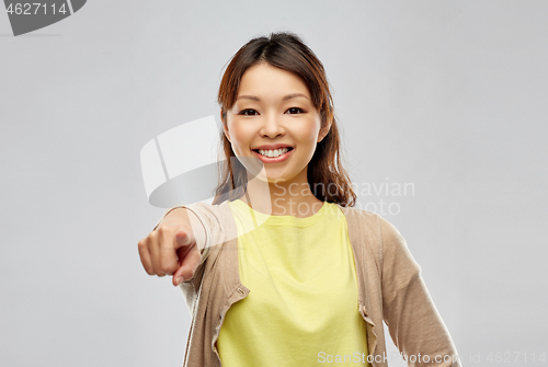 Image of asian woman pointing finger to you