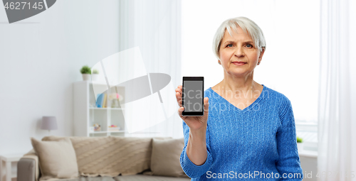 Image of senior woman showing smartphone